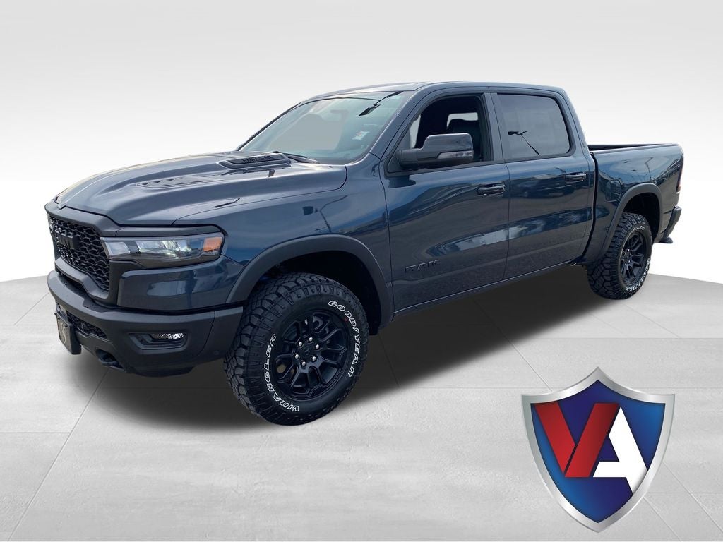 2026 RAM Ram 1500 RAM 1500 REBEL CREW CAB 4X4 5'7' BOX in Forged Blue Metallic Exterior Paint — front three-quarter view